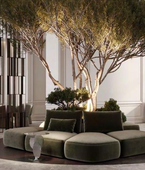 Visualisation of a living area with a planted tree and curved sofa, Jumeirah Island